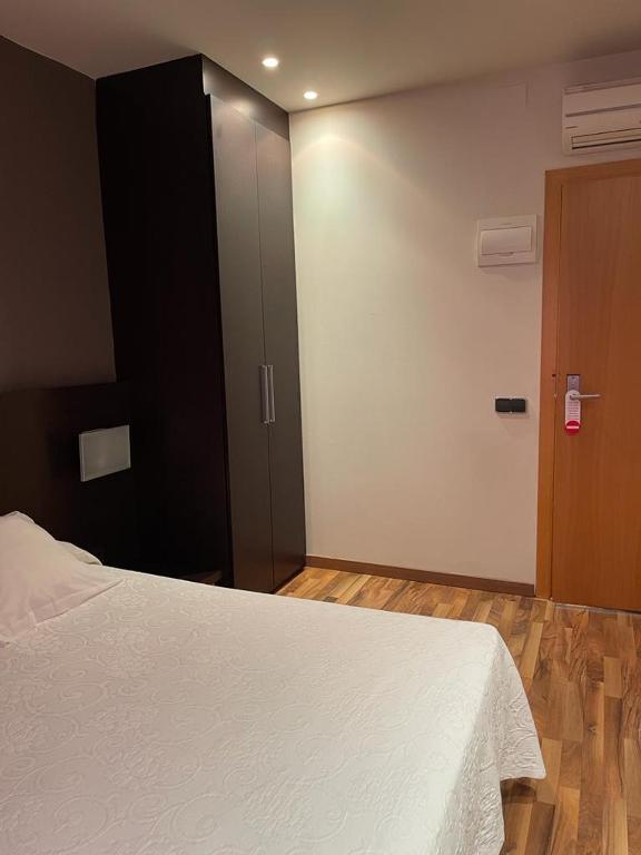 Postel nebo postele na pokoji v ubytování Hotel Bruc