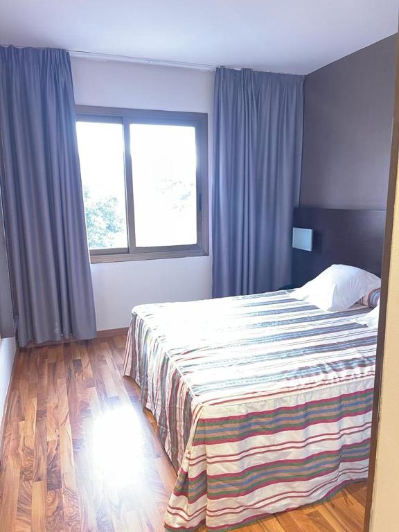 Postel nebo postele na pokoji v ubytování Hotel Bruc