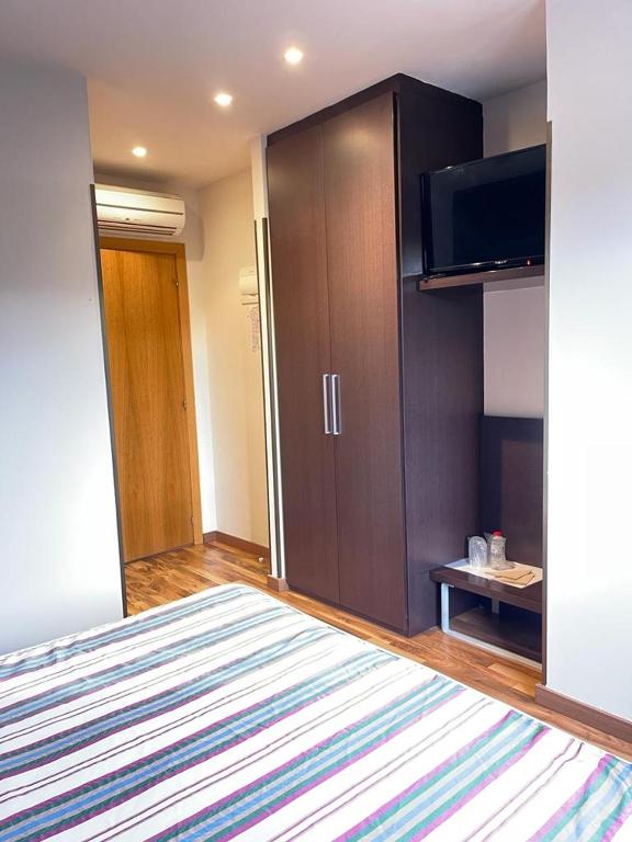 Postel nebo postele na pokoji v ubytování Hotel Bruc