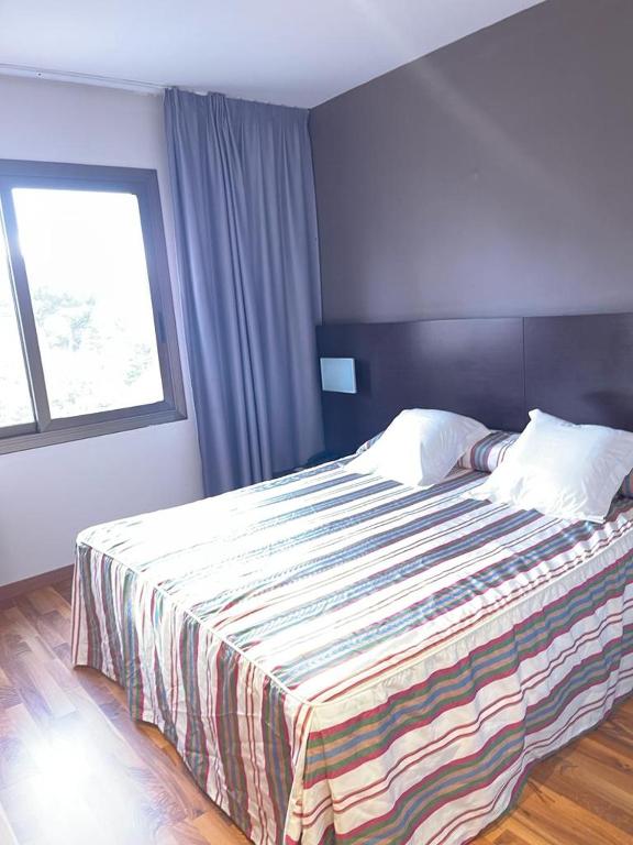 Postel nebo postele na pokoji v ubytování Hotel Bruc