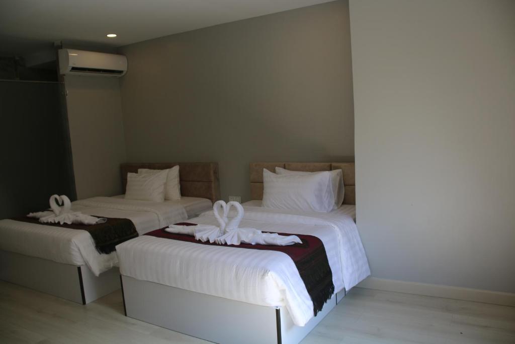 Postel nebo postele na pokoji v ubytování Ostro Hotel