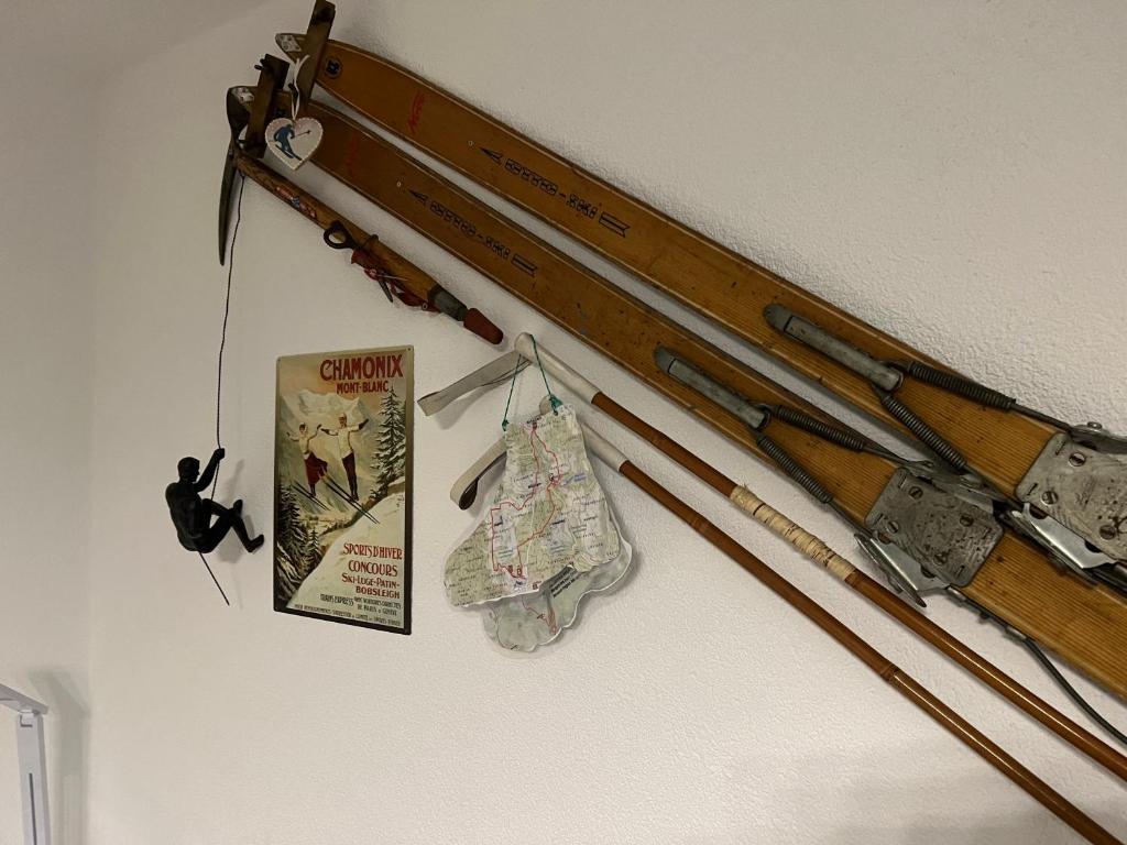 a group of weapons hanging on a wall at Appartement Bergwaerts in Rickenbach