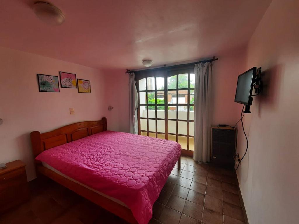 En eller flere senge i et værelse på Colibrí departamentos