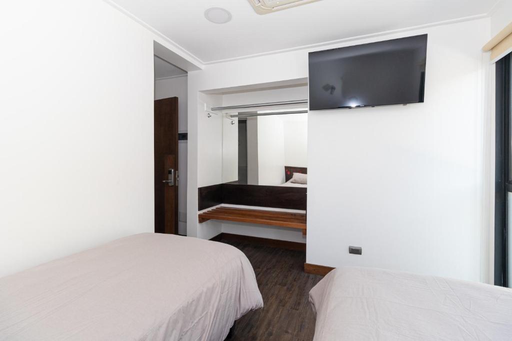 Postel nebo postele na pokoji v ubytování Hotel Boutique Ossido Nero