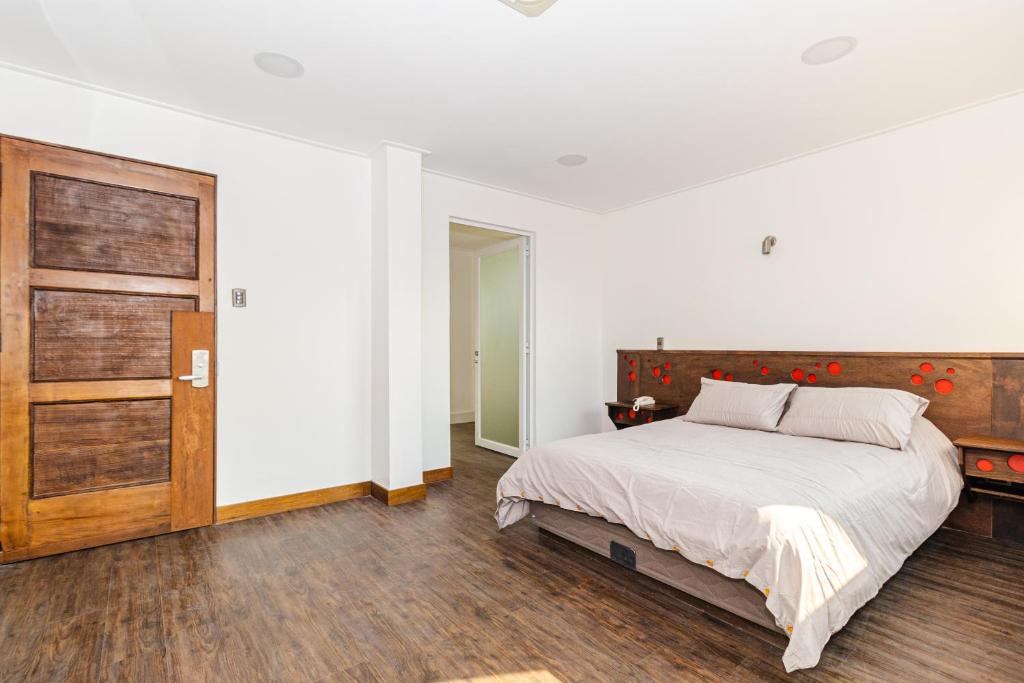 Postel nebo postele na pokoji v ubytování Hotel Boutique Ossido Nero