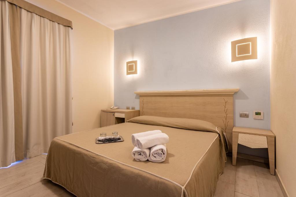 Postel nebo postele na pokoji v ubytování Hotel Belvir