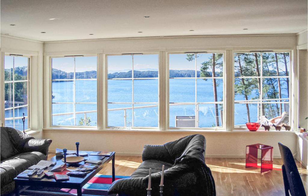 a living room with a view of the water at Stunning Home In Hagavik With 5 Bedrooms And Internet in Hagavik