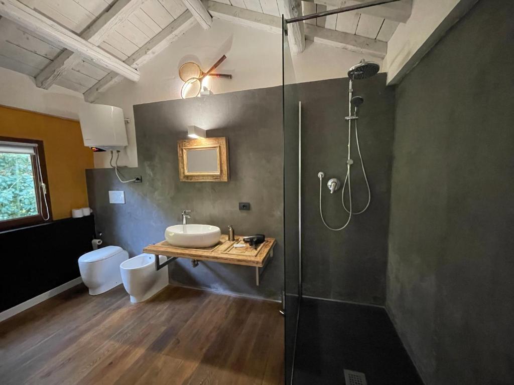 a bathroom with a shower and a sink and a toilet at Residence Villa Masi in Ferrara