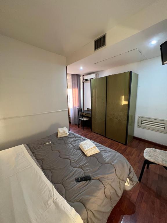 Postel nebo postele na pokoji v ubytování Hotel Como