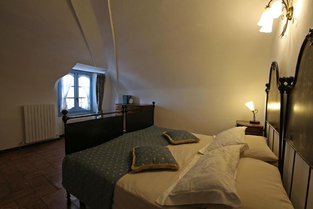 Postel nebo postele na pokoji v ubytování Palazzo Del Vicerè