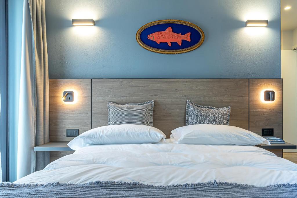 Postel nebo postele na pokoji v ubytování Hotel Mon Émile
