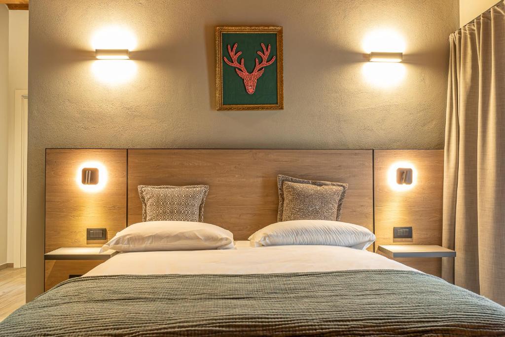 Postel nebo postele na pokoji v ubytování Hotel Mon Émile