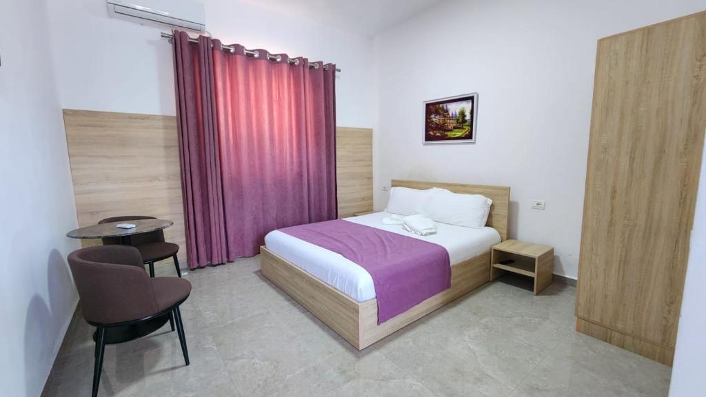 Postel nebo postele na pokoji v ubytování Sweet Hotel