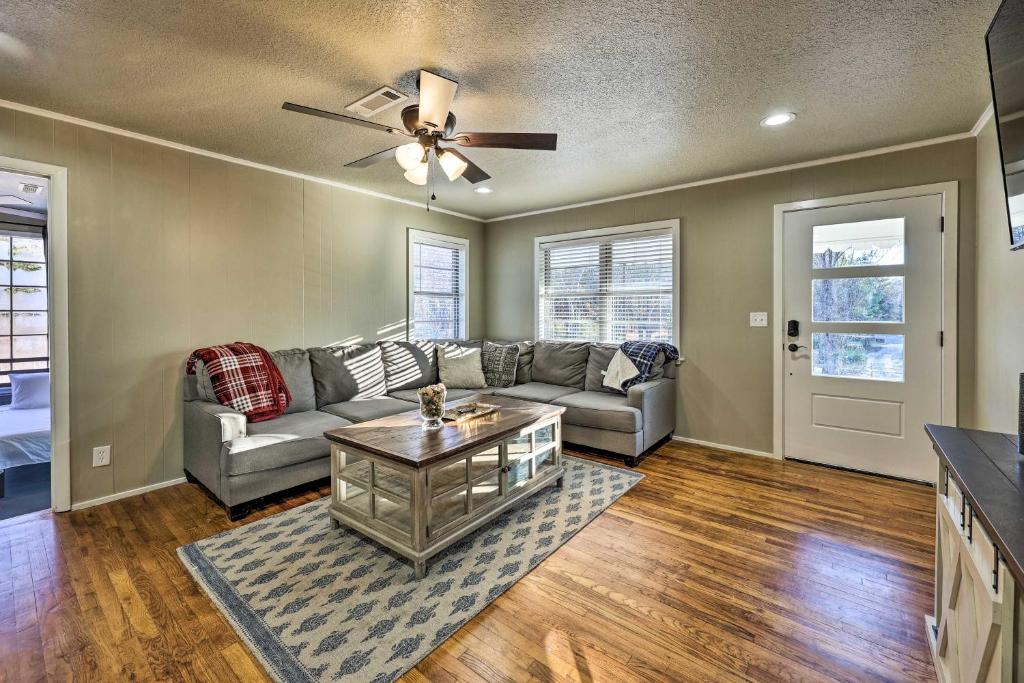 a living room with a couch and a ceiling fan at Fayetteville Vacation Rental - 2 Mi to Dtwn! in Fayetteville