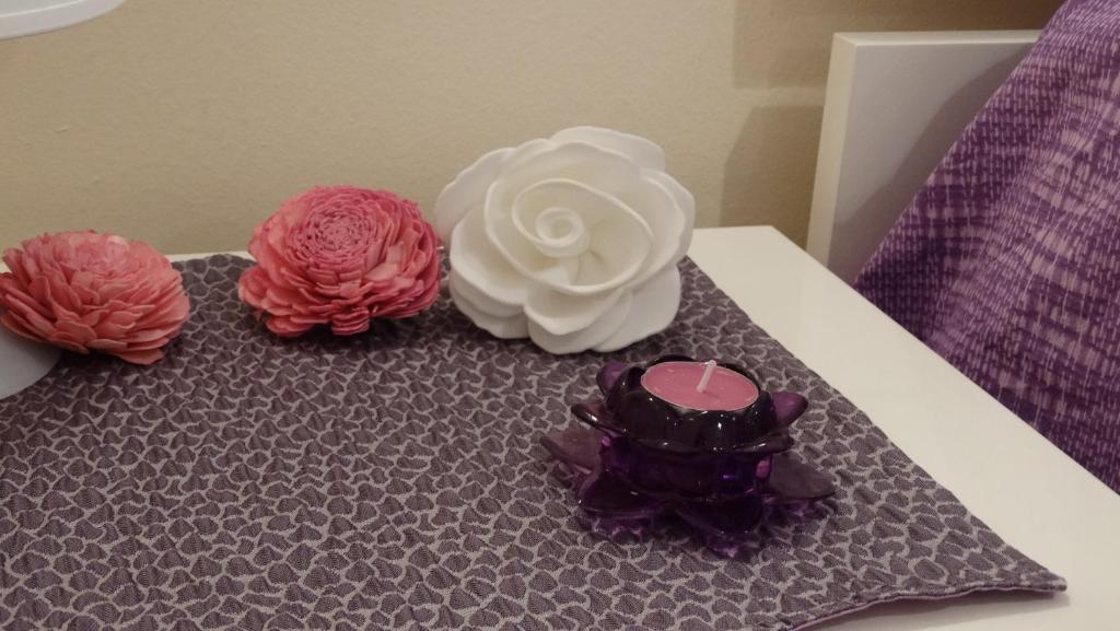 En eller flere senge i et værelse på Casa Margherita