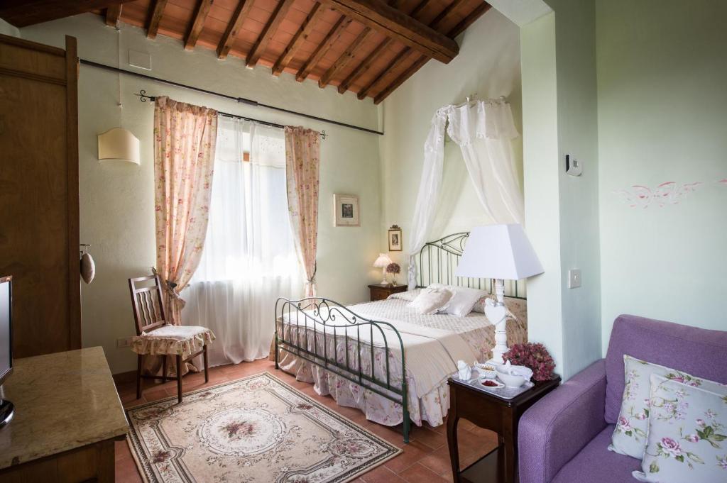 Postel nebo postele na pokoji v ubytování Agriresort & Spa Fattoria I Ricci