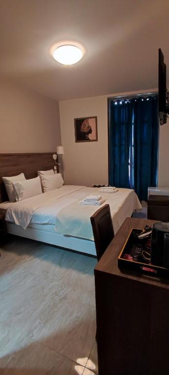 Postel nebo postele na pokoji v ubytování SQUARE HOTEL