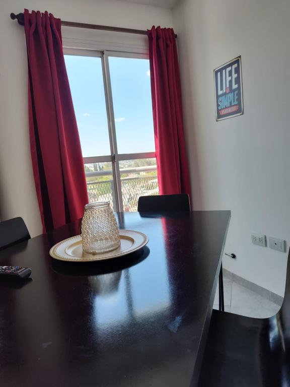 a dining room table with a hat on top of it at ALTOS DE CLERMONT in Cordoba