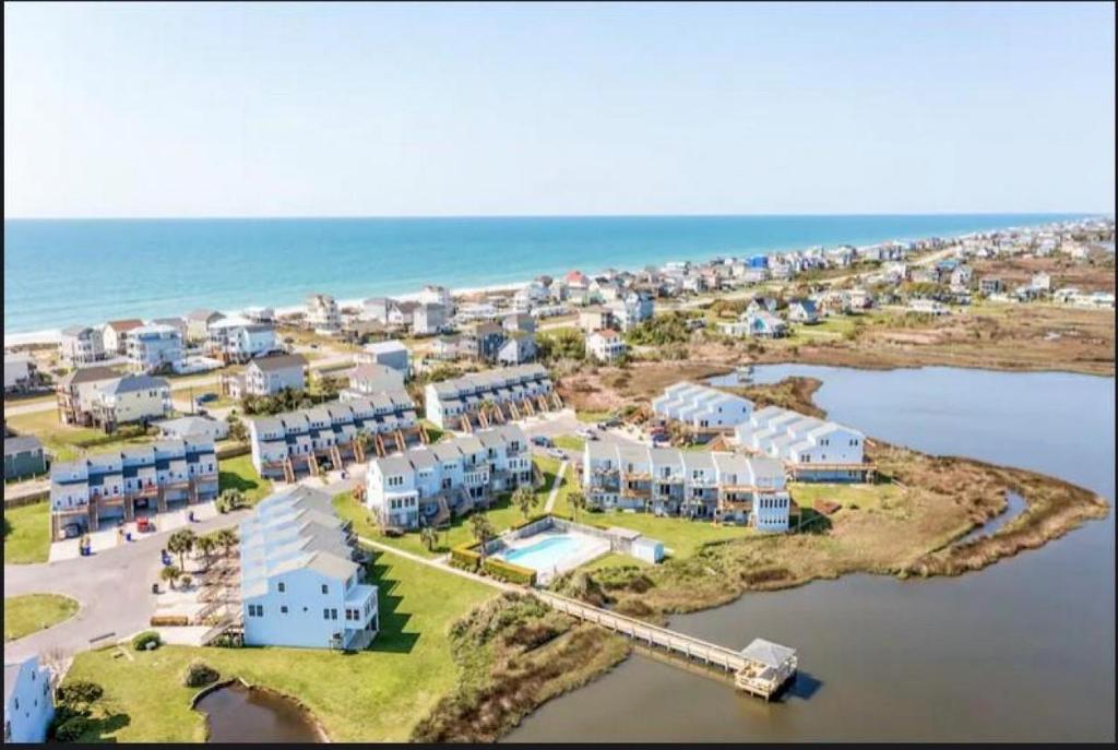 an aerial view of a resort next to the ocean at The Salted Rim in North Topsail Beach
