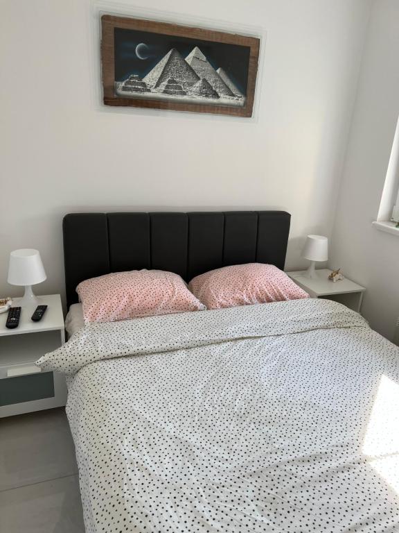 Postel nebo postele na pokoji v ubytování Apartmani K&V