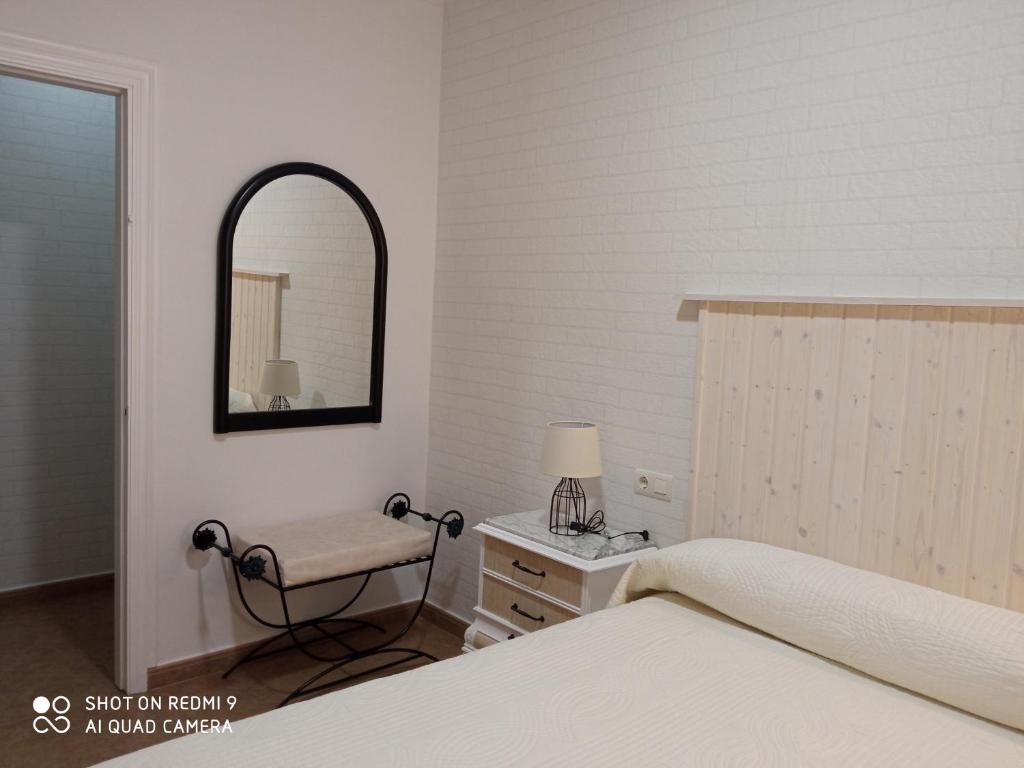 Postel nebo postele na pokoji v ubytování Apartamentos Virgen de Villaverde