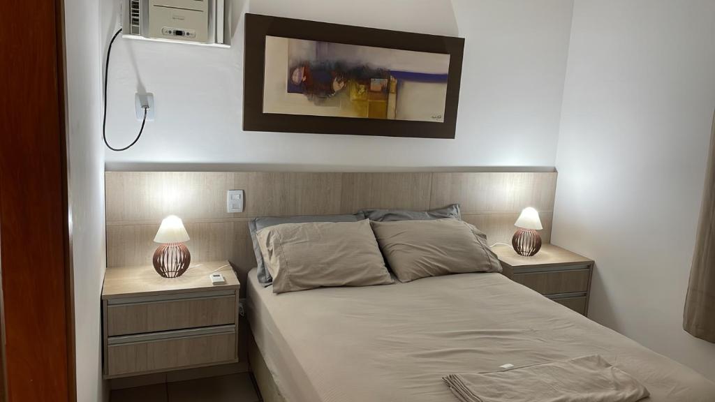 Cama o camas de una habitación en Apartamento Climatizado com Sacada e Churrasqueira