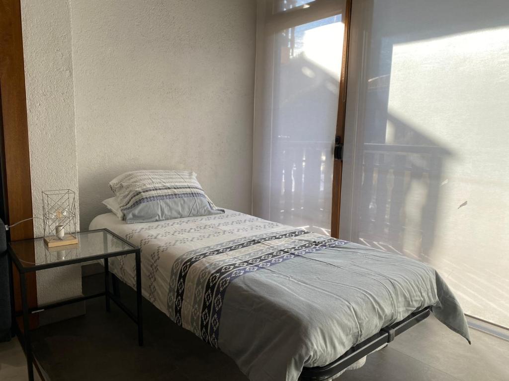 Postel nebo postele na pokoji v ubytování Prober Comapedrosa