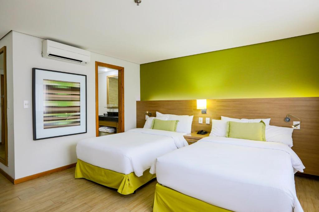 Postel nebo postele na pokoji v ubytování Radisson Hotel Belém