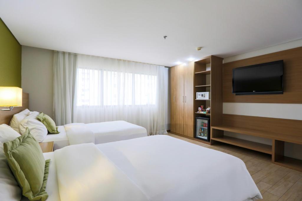 Postel nebo postele na pokoji v ubytování Radisson Hotel Belém