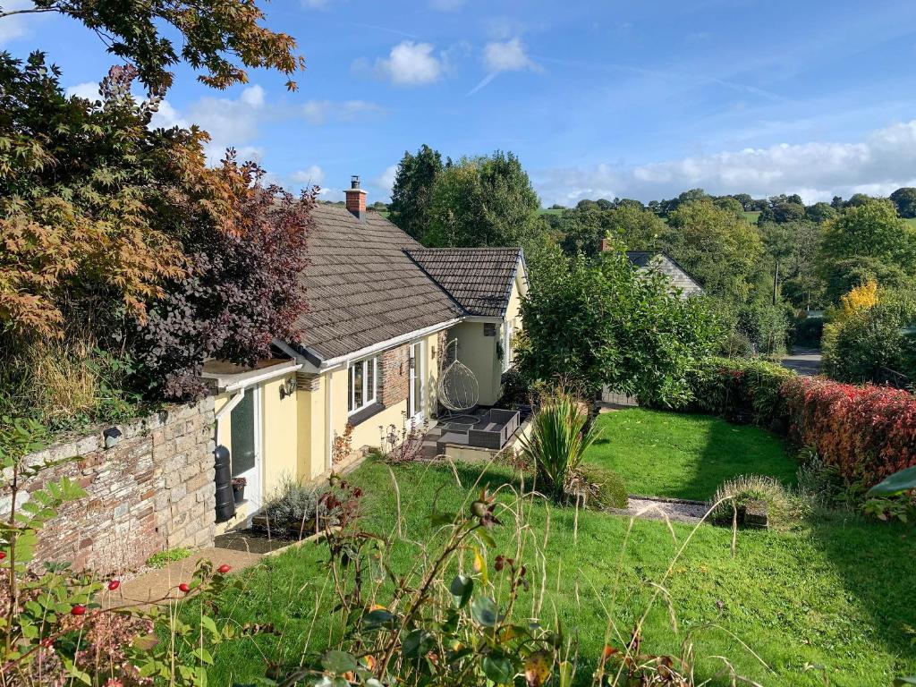 a house with a stone wall and a yard at Uk41511 - Mardin in Boyton