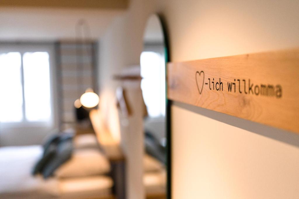 Postel nebo postele na pokoji v ubytování Gyger Restaurant Confiserie B&B