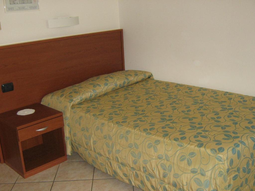 Postel nebo postele na pokoji v ubytování Hotel Sanremo