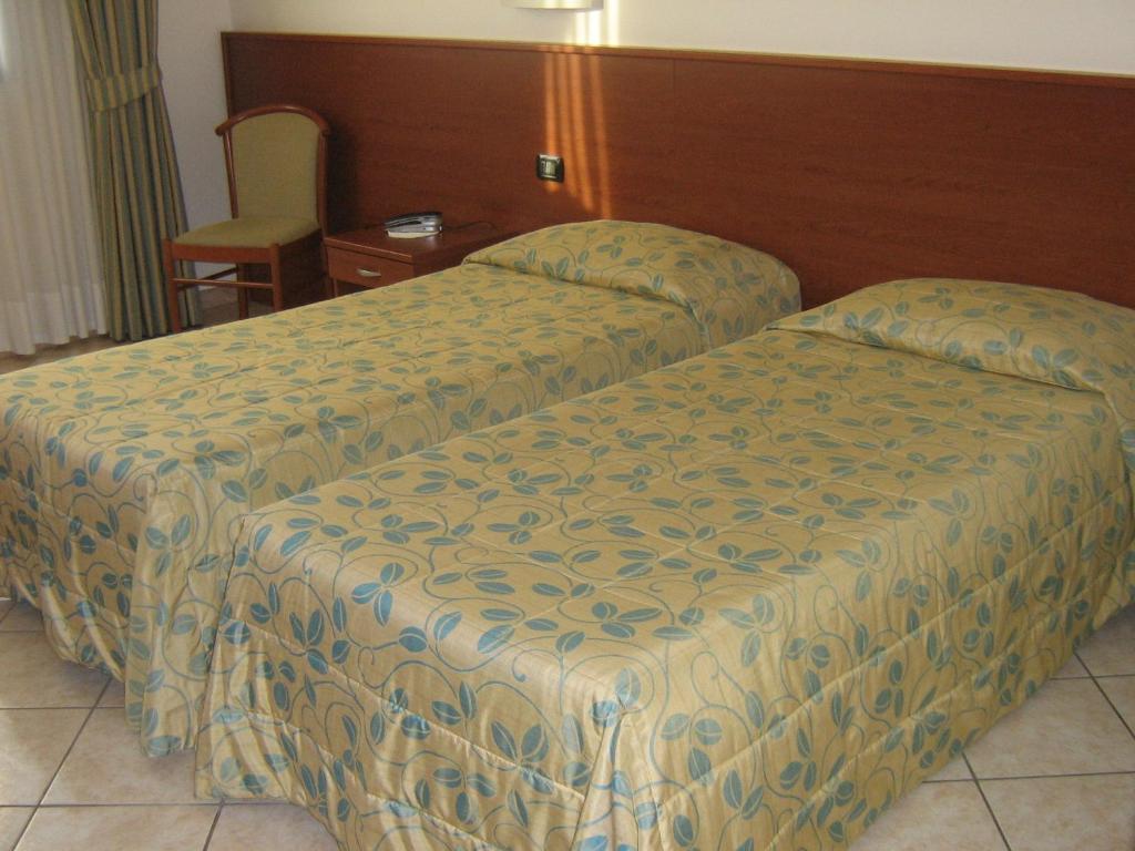 Postel nebo postele na pokoji v ubytování Hotel Sanremo