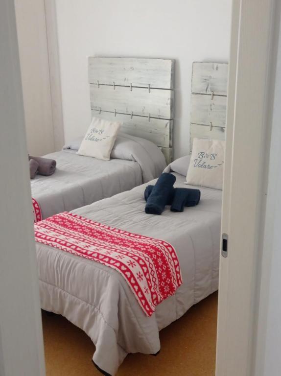 Posteľ alebo postele v izbe v ubytovaní B&B VOLARE