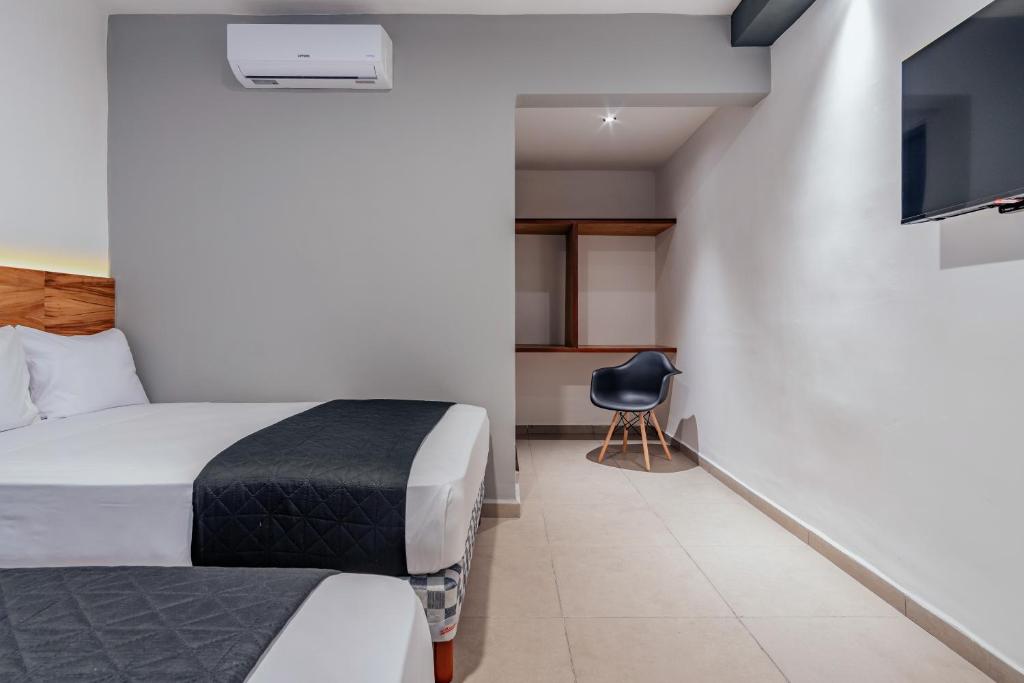 TV a/nebo společenská místnost v ubytování Hotel Mody Merida
