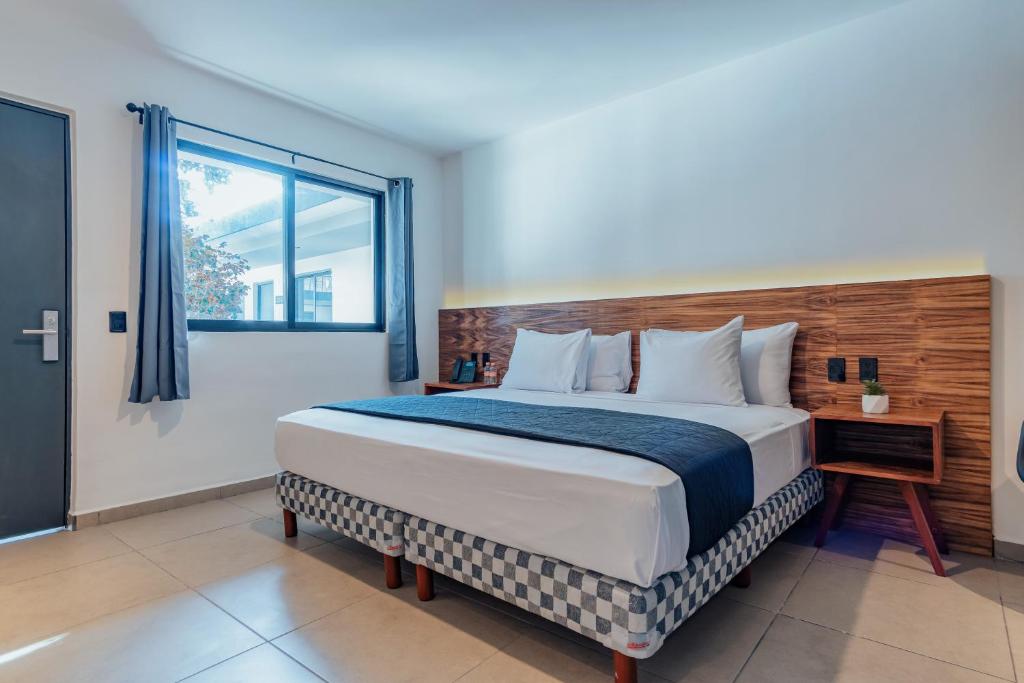 Postel nebo postele na pokoji v ubytování Hotel Mody Merida