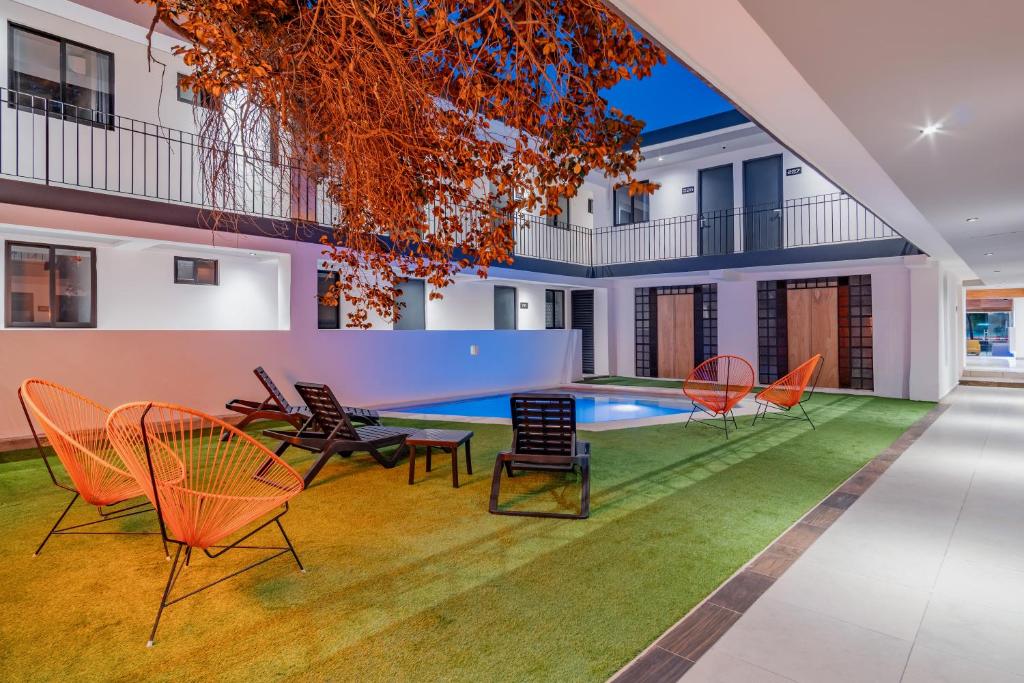 Bazén v ubytování Hotel Mody Merida nebo v jeho okolí