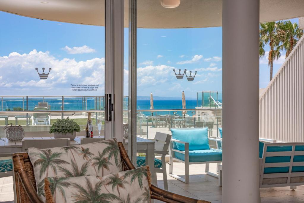 a living room with a view of the ocean at Crest Premium View Apartment 32 in Noosa Heads