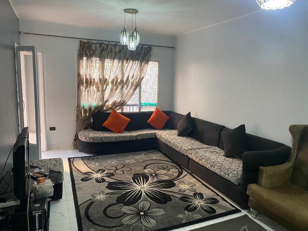 a living room with a couch and a rug at A lovely apartment for rent in Cairo