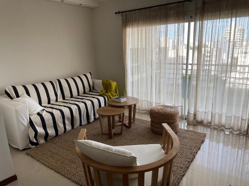 a living room with a couch and a table at Corrientes Pora in Corrientes