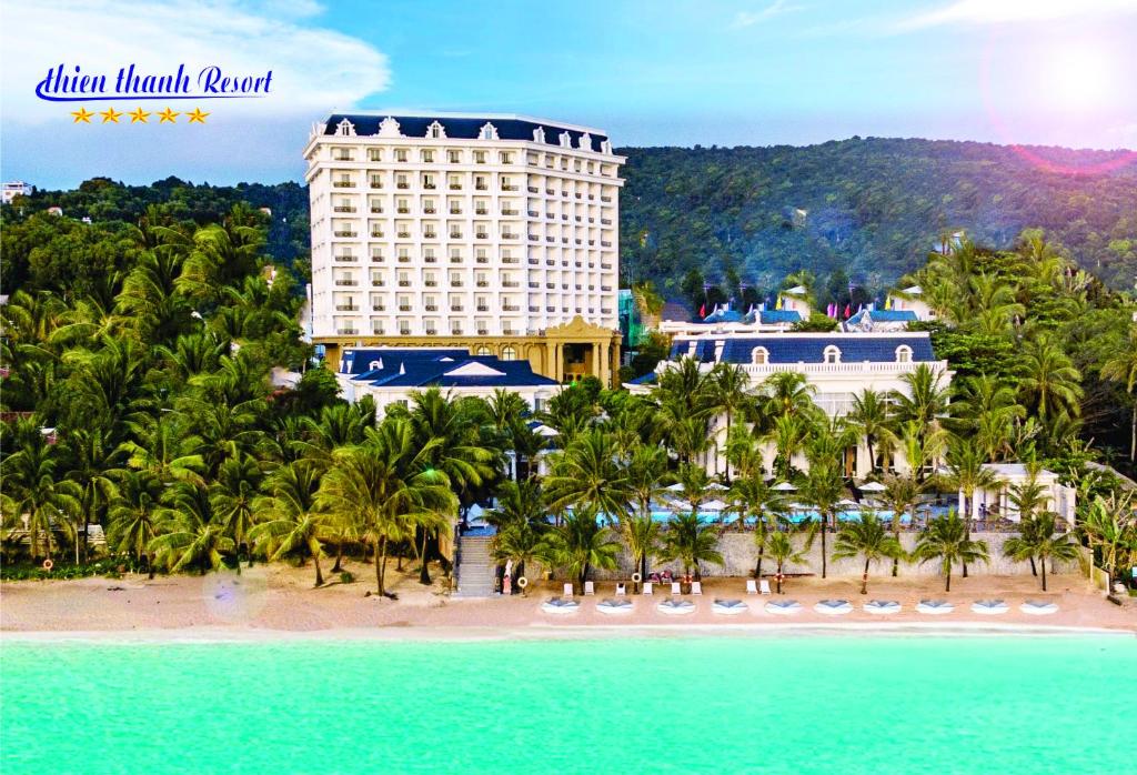 a view of the blue mountain resort from the beach at Thien Thanh Resort in Phu Quoc