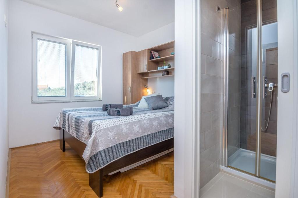 Posteľ alebo postele v izbe v ubytovaní Apartment Radovic Nives