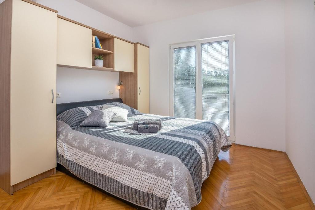 Posteľ alebo postele v izbe v ubytovaní Apartment Radovic Nives