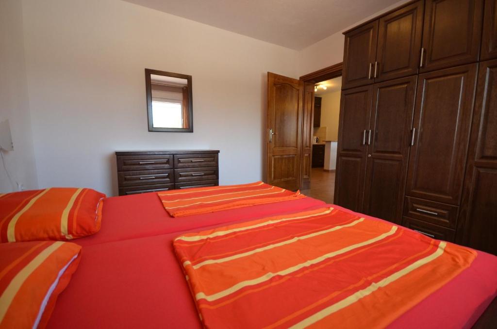 Postel nebo postele na pokoji v ubytování Apartments Komljen
