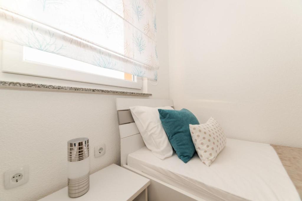 Postel nebo postele na pokoji v ubytování Apartments Kovacevic