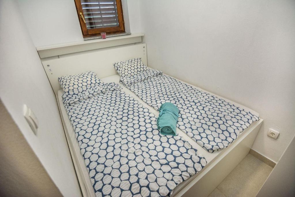 Posteľ alebo postele v izbe v ubytovaní Apartments Malcic