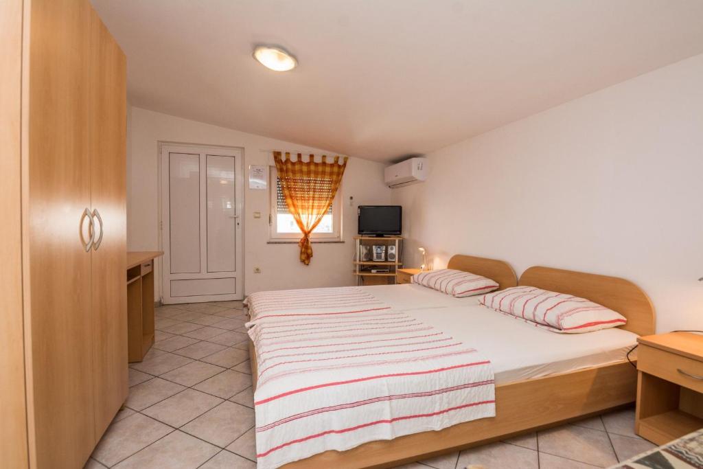 Posteľ alebo postele v izbe v ubytovaní Apartments Delic Pejic