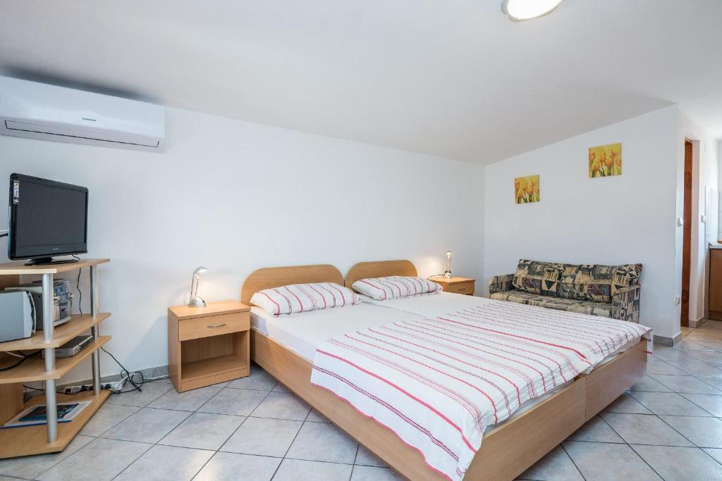 Posteľ alebo postele v izbe v ubytovaní Apartments Delic Pejic
