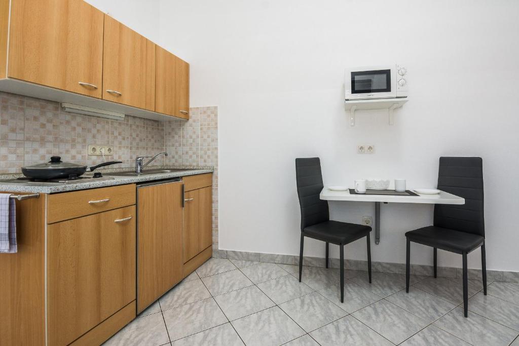 Kuchnia lub aneks kuchenny w obiekcie Apartments Skundric