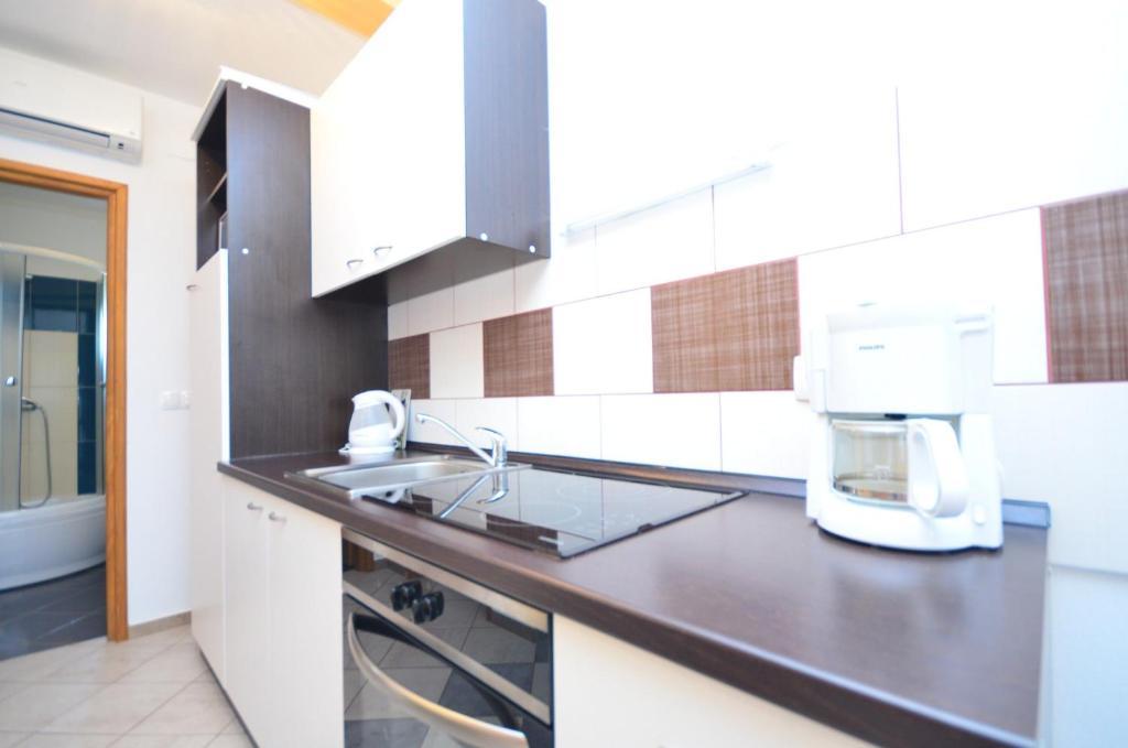 Kuchyň nebo kuchyňský kout v ubytování Apartments Brandis